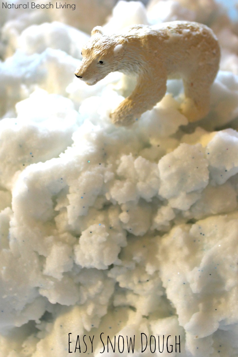 This Homemade Snow Dough is THE BEST! A simple 2 ingredients sensory recipe and it's just like real snow. Your kids will love this Snow Dough Recipe it's perfect for Winter Sensory Play or a Winter Animals Preschool Theme. 
