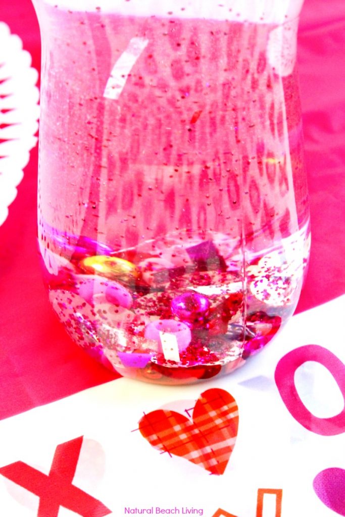 How to Make Valentines Sensory Bottles Kids Love, Valentine's Day Sensory Bottles are perfect for any home or classroom activity, Homemade sensory bottles make a great addition to any Science table, Calm down bottles, DIY Sensory Bottle, Easy sensory activity for preschoolers and Toddlers, Valentine's Day craft for kids, #sensoryplay #Valentinesdaycrafts #sensorytoys #sensoryprocessingdisorder 