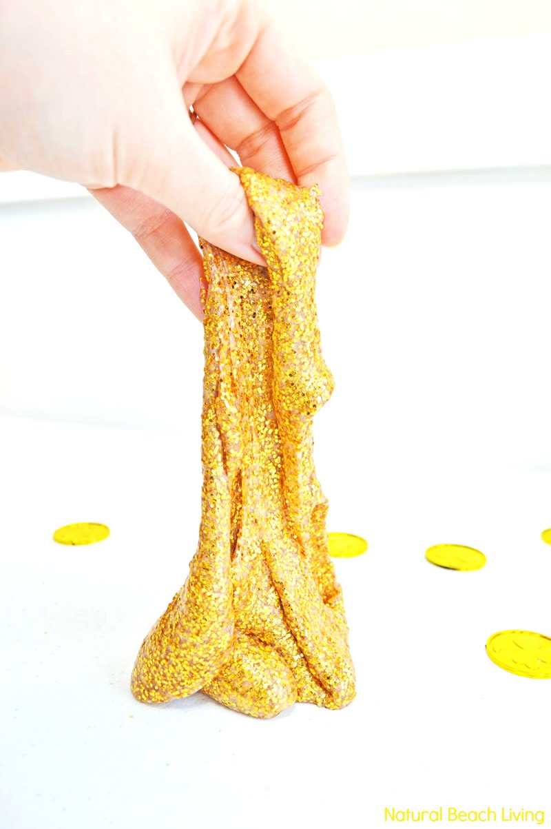 How to Make Slime Recipe with Contact Solution that's perfect for St. Patrick's Day Sensory play, This Perfect Gold Glitter Contact Solution Slime Recipe is One of the Best Sensory Play Ideas for Kids, Homemade slime is super easy to make with our slime recipes. See how to make slime with contact solution and The Best Slime Recipes here.