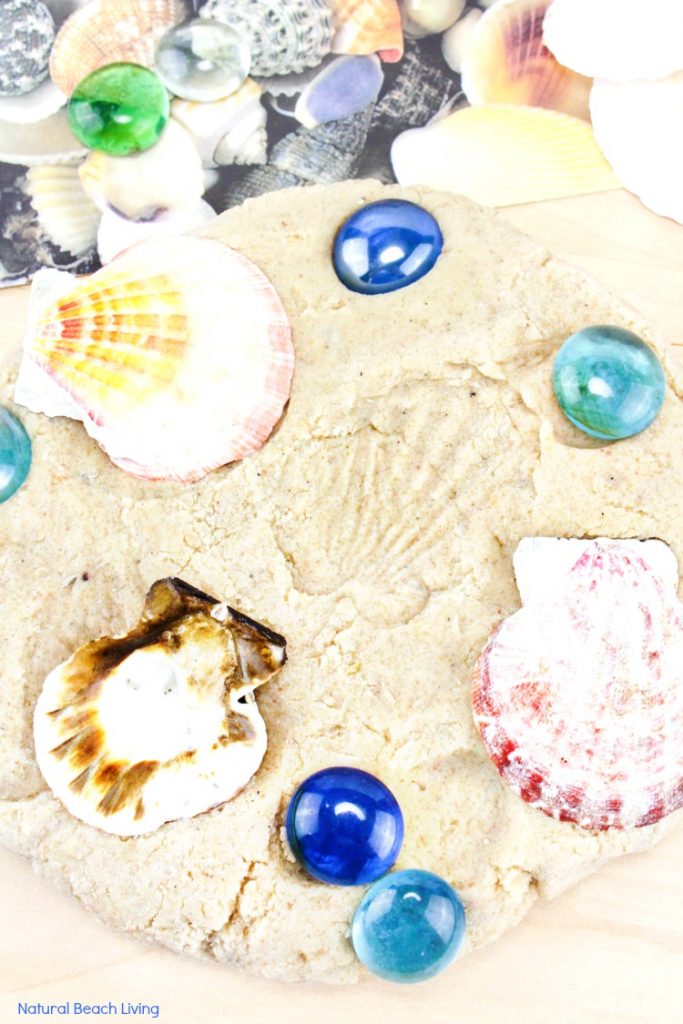 Kids love making imprints of the seashells on this sand playdough. Make DIY Sand Play dough for a perfect Beach Theme Playdough recipe, this Textured Playdough is fun sensory play and summer activity 