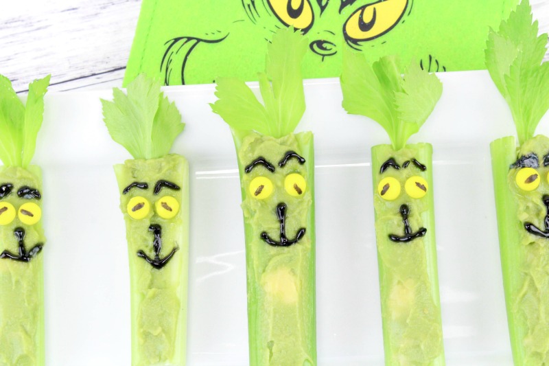 Healthy Grinch Snacks, Grinch Food, Grinch Christmas Treats that are healthy treats for kids and adults. Serve these up for a Grinch Party food or an afternoon snack for the kids. Munching on Grinch Celery Snacks is a delicious, healthy treat everyone can eat. 