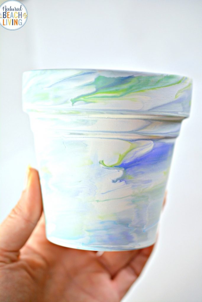These Marbled Pots are AMAZING and perfect for Garden Art Projects for Kids. In the spring everyone should enjoy garden crafts for kids and outside activities. These tie dye flower pots are fun Earth Day Garden Activities and Great Gardening Activities for Preschoolers and Kindergarten, Planting Crafts for Kids