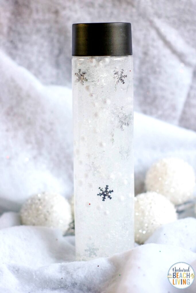 You'll love making these Snow Sensory Bottles for all your winter sensory play. So simple to make and certain to provide hours of fun. All you need are a few supplies and your toddlers will enjoy these beautiful calming sensory jars. In fact, this snow sensory play activity is one of the best indoor snow day ideas, ever. Winter Sensory Bottles