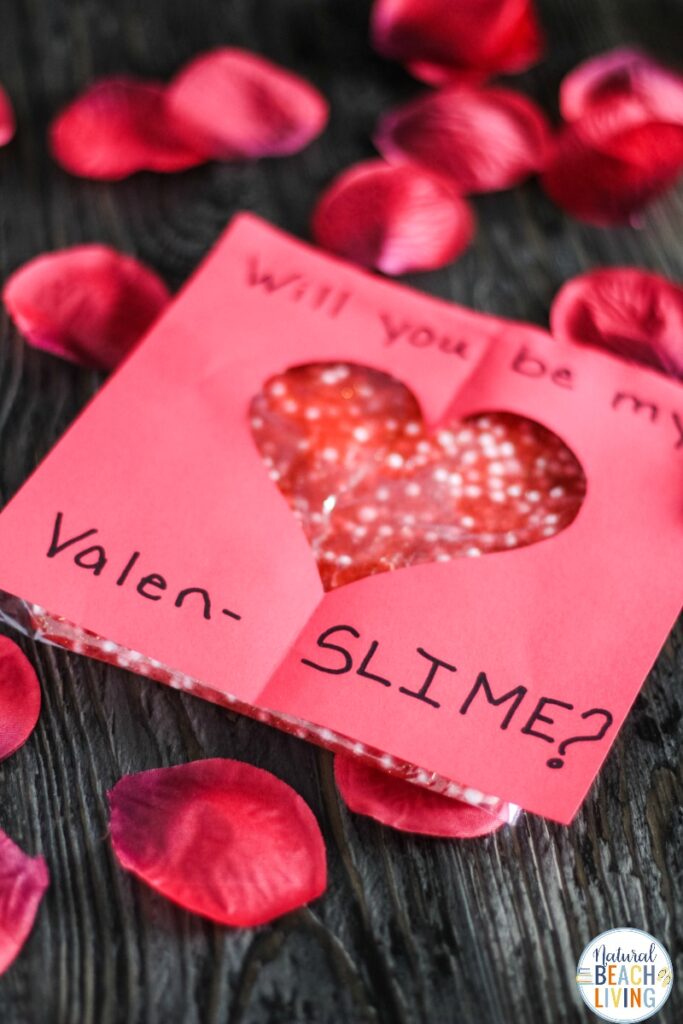 This Valentines Day Slime Card is so simple and easy to make. Plus, it's a unique Valentines Day Slime Recipe and easy Valentine Crafts for Preschoolers. This Valentine's Day Floam Slime is an awesome sensory activity and a super cool Kid Valentine Card, Use this Valentine Craft idea for a Preschool Valentine Theme Kids Love! 