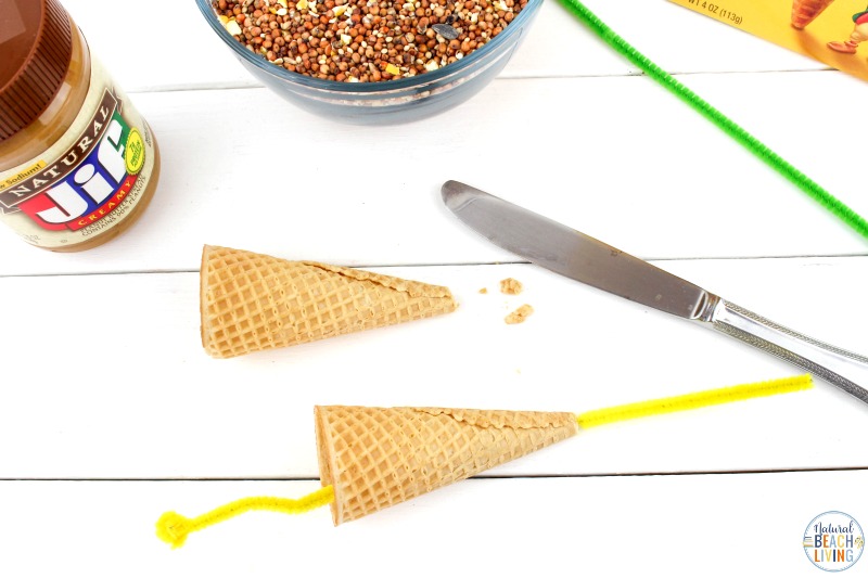This Ice Cream Cone Bird Feeder is such a simple project. Perfect for Spring, Summer, Earth Day, or any time of the year. Your backyard birds are certain to be happy with these Bird Seed Ornaments! This is a super fun Kid Made Bird Feeder with only a few ingredients. See how to make a bird feeder with over 30 homemade bird feeders