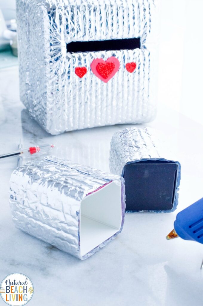 This Robot Valentine Box is so much fun! A super cute Valentine's Day Card Box that you can easily make with recycled materials? Your kids will love this DIY Robot Valentine Box, Gather up your supplies and get ready to have fun creating this DIY robot! 